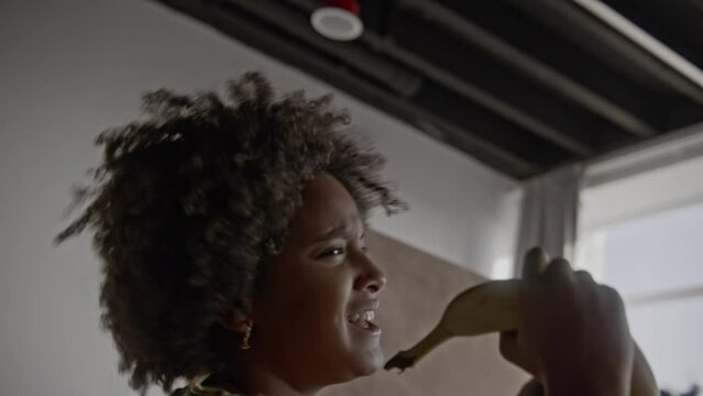 a close up of a girl singing in group of children playing music together in a band