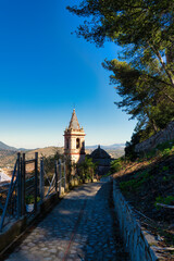 Naklejka premium The Baroque church of Santa Maria de la Mesa has a pink marble main façade and a bell tower that can be seen from all over the town, Andalusia, Spain