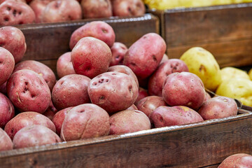 Fresh Organic Red Potatoes stacked together in a basket