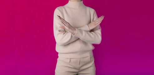 girl with crossed arms on a pink background. concept of protest, BreakTheBias