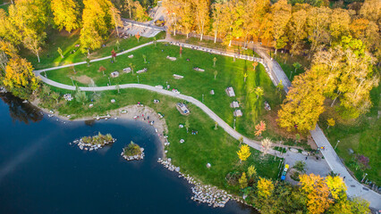 Aerial view of the Augarten city park in autumn mood with the river Mur streaming through the city...