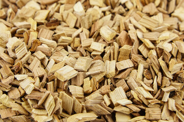 Wood chips for smocking texture background. Natural wood smoking chunks, top view - obrazy, fototapety, plakaty