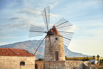 Windmill in the Saline di Trapani e Paceco natural reserve near Trapani, Sicily, Italy. Old...