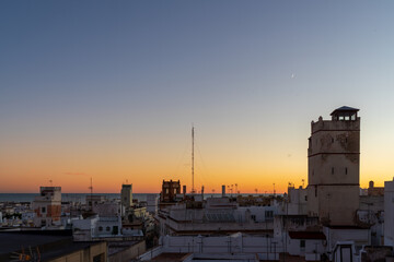 Colorful sunset over the historic center of the ancient city of Cádiz in Andalusia Spain