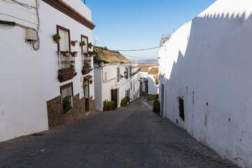 Obraz premium The winding streets of white houses in the old historic center of Medina Sidonia are a pleasure to walk through