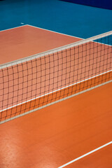 Background of Volleyball court with net in old school gym, top view, copy space. Sports image of...