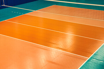 Backdrop sports image of volleyball courts in sport hall. Volleyball court with net in old school...