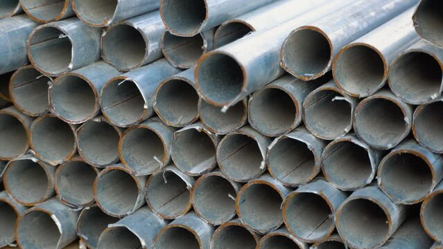 Metal pipes made of rectangular profile in a commercial warehouse