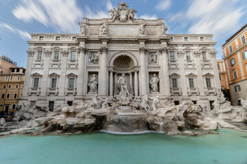 Trevi Fountain (Fontana di Trevi) during a sunny day, long exposure photo of the famous fountain in...