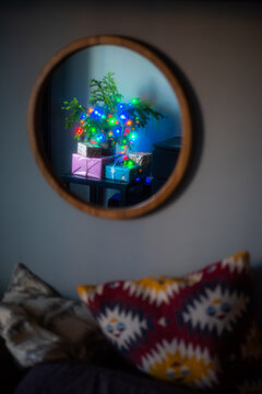 Bright Garland Christmas Tree With Gifts In Round Mirror