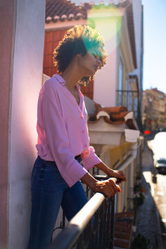 Thoughtful And Pensive Portrait Outside On The Balcony 