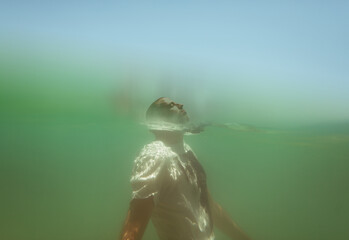 Underwater portrait of a man floating in the sea