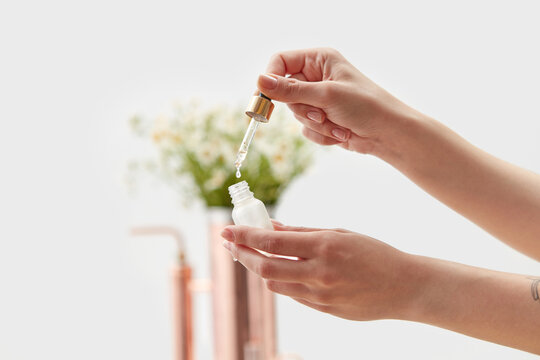 Perfumer working on oil distilling