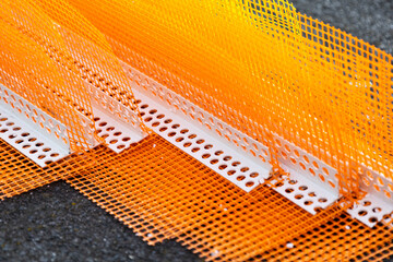 Many building corners with reinforcing mesh for finishing work, home building materials