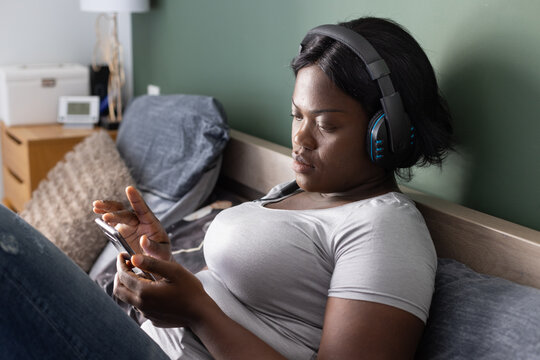 woman using smartphone at home