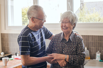 happy couple moment, smiling senior retired man and woman at home