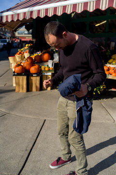 Man alone at the pumpkins market