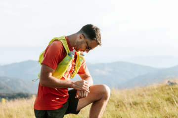 Runner Looking At His Watch.