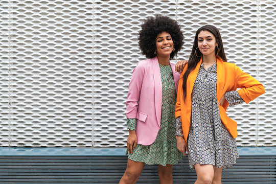 Multiracial women sharing free time in coworking space