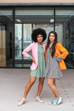 Multiracial women sharing free time in coworking space
