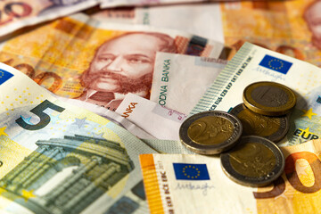 Croatia joins the eurozone..Croatian banknotes and European banknotes (Kuna and Euro).