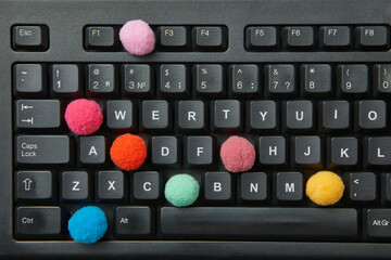 Colorful balls in place of keys in keyboard.