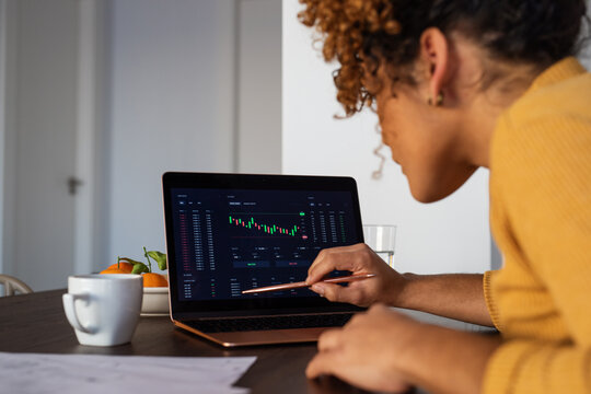 Focused businesswoman analyzing stock market data