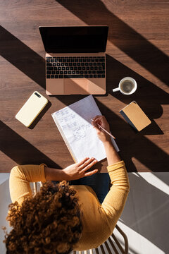 Female studen sitting at table and working