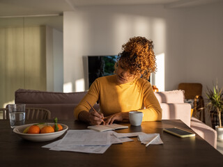 Hispanic manager working in dining room
