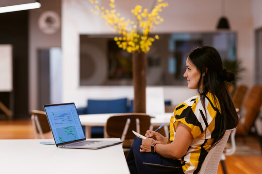 Woman sitting at office desk working