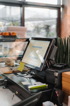 Cash register on counter in cafe