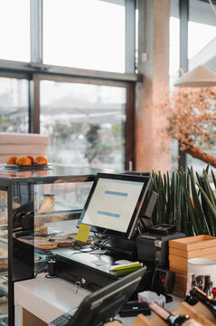 Cash register on counter in cafe