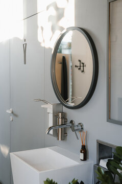 Modern bathroom interior with ceramic sink and mirror
