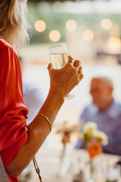 Close Up Of Woman Holding A Glass Of Champagne