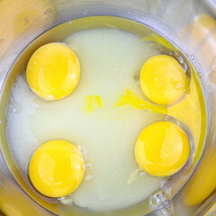 Egg yolks on top of sugar for baking a cake