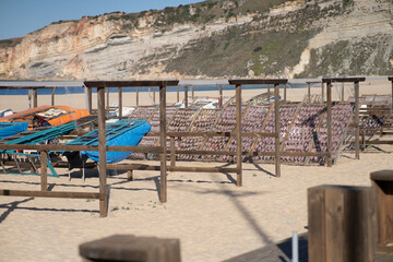 A day at the beach. Lovely colors and the sea just ahead in the village of Nazaré where the biggest waves in the world are surfed.