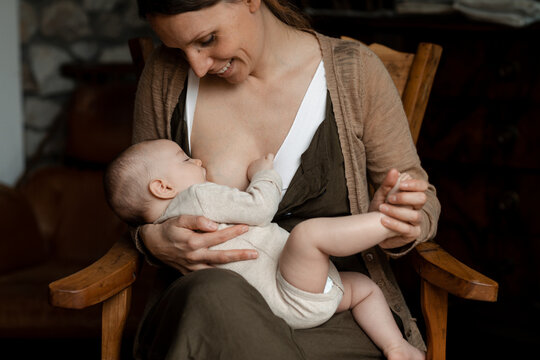 Mother Breastfeeding Her Baby Girl
