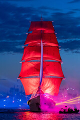 A ship with scarlet sails. Floats along the Neva River in the city of St. Petersburg. A celebration dedicated to school graduates. - 546716709