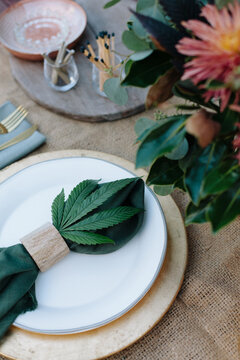 Fall-themed table place setting with cannabis