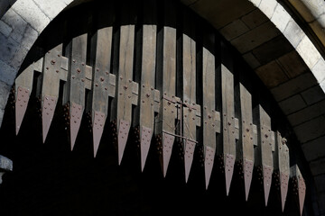 portcullis with metal spikes on a medieval gate castle in cologne