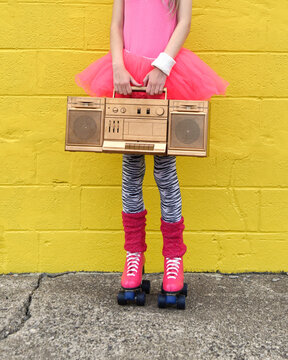 80s Girl Holding Stereo and Roller Skates