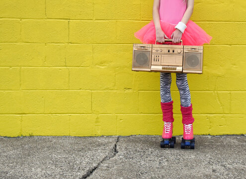 Girl Holding Music Box and Roller Skates