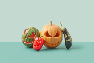 Various vegetables with Halloween carvings.