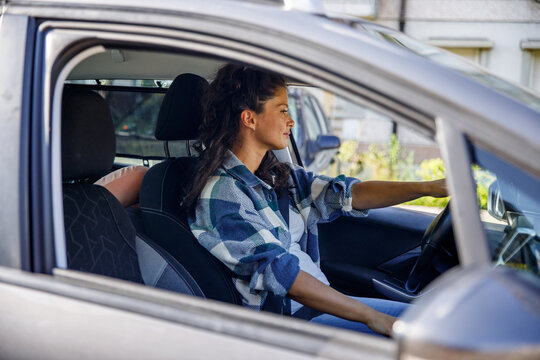 Woman driving car alone 