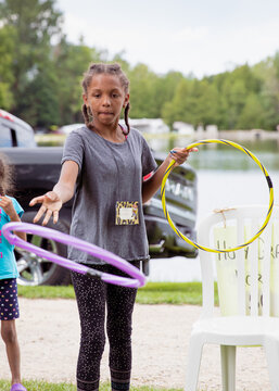 Child throwing rings at a homemade target