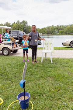 Child throwing rings at a homemade target