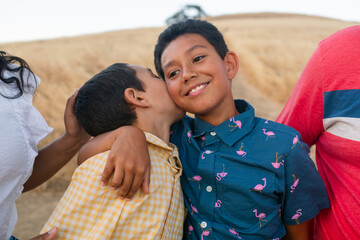 Children giving a kiss outdoor