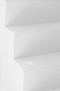 Close Up Of Geometric Modern White Stairs With Shadows