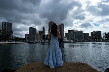 Beautiful shot of a woman in a long dress posing in Honolulu, Hawaii