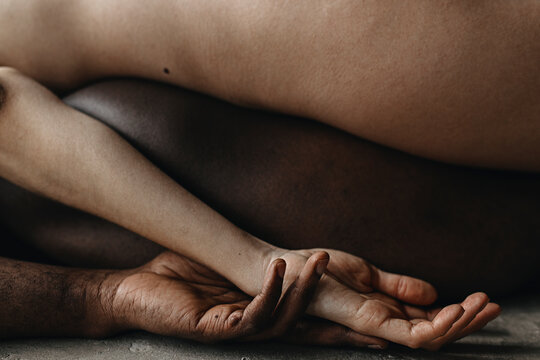 Close up photo of Multiethnic Love Couple With Hand In Hand

